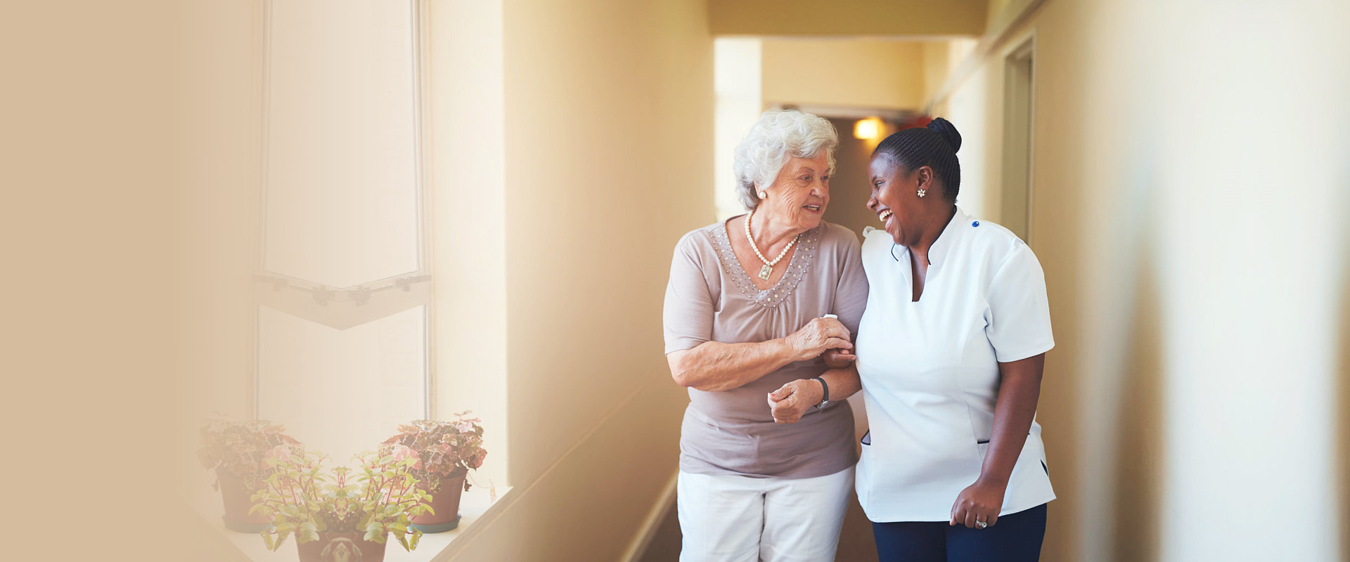 caregiver assisting elderly woman