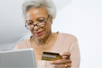 elderly woman using laptop